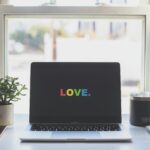 lgbtq+ therapy online computer screen with love in rainbow letters